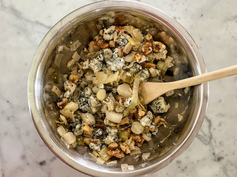 Bowl of blue cheese, walnuts, and leeks