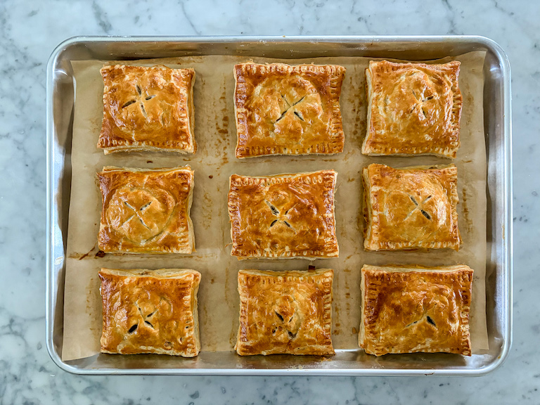 Puff pastry hand pies on a tray