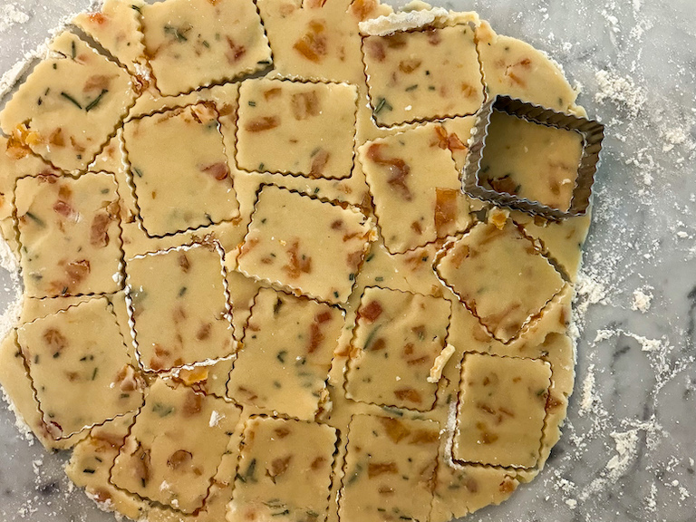 Cutting shortbread with a metal biscuit cutter