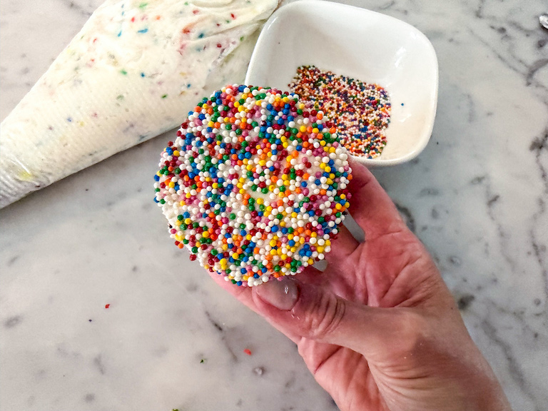 hand holding a homemade dot cake