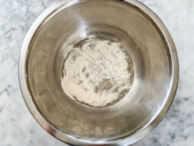 Gelatin and water in a bowl