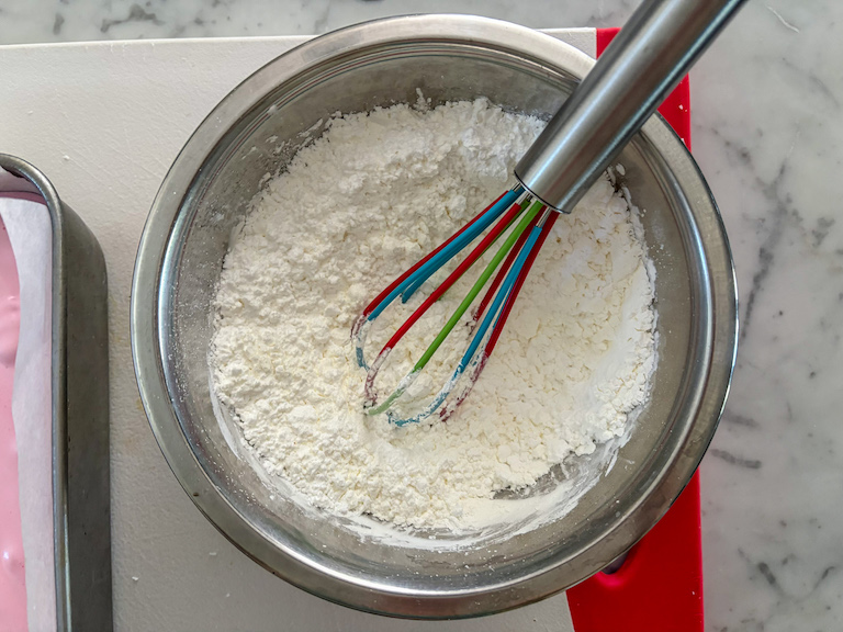 marshmallow coating in a bowl with a whisk