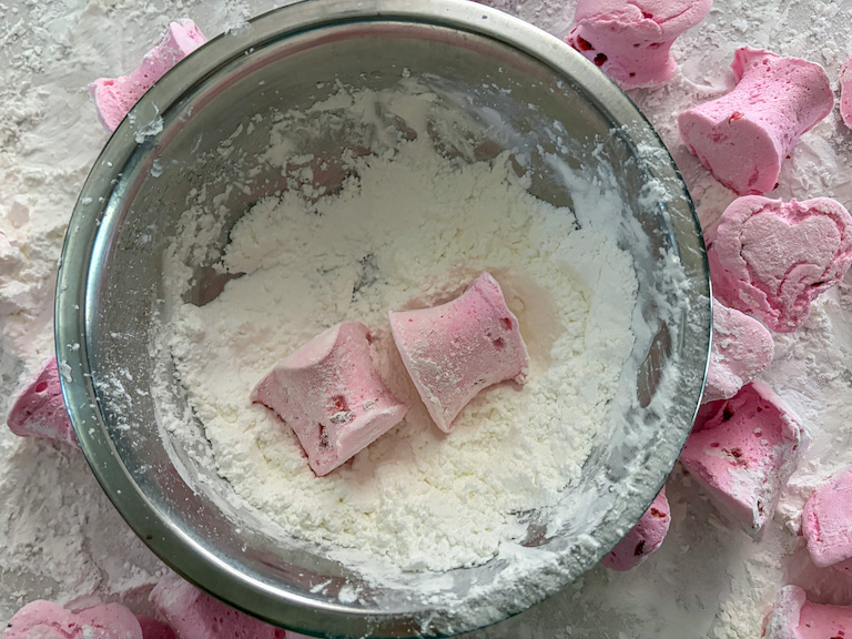 bowl of sugar with two pink heart marshmallows