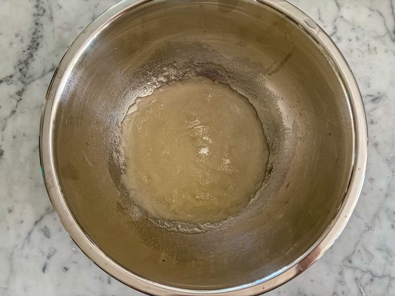 gelatin and water in a metal bowl
