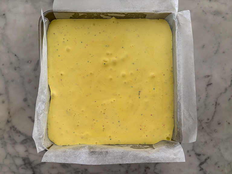 Cake batter marshmallows setting in a pan