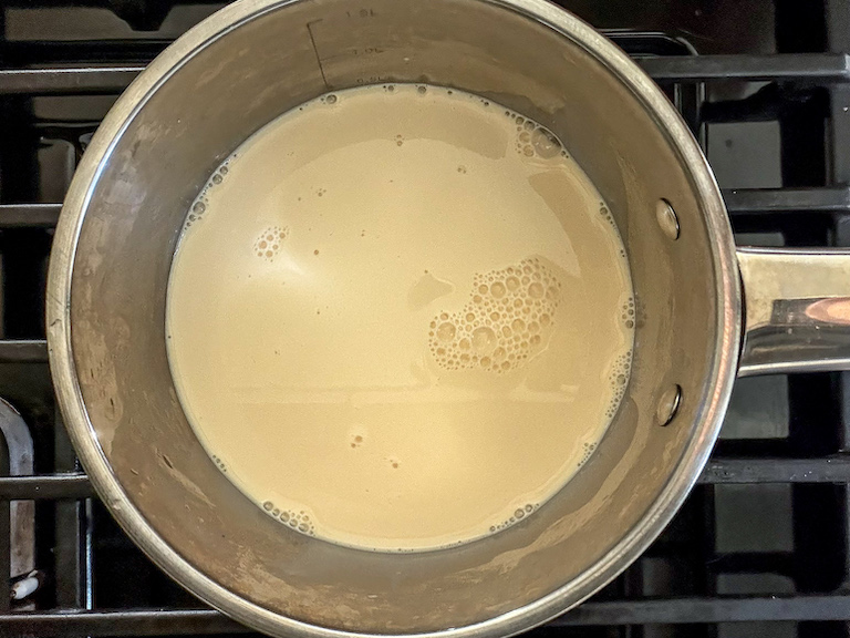 Pan of evaporated milk on the stovetop