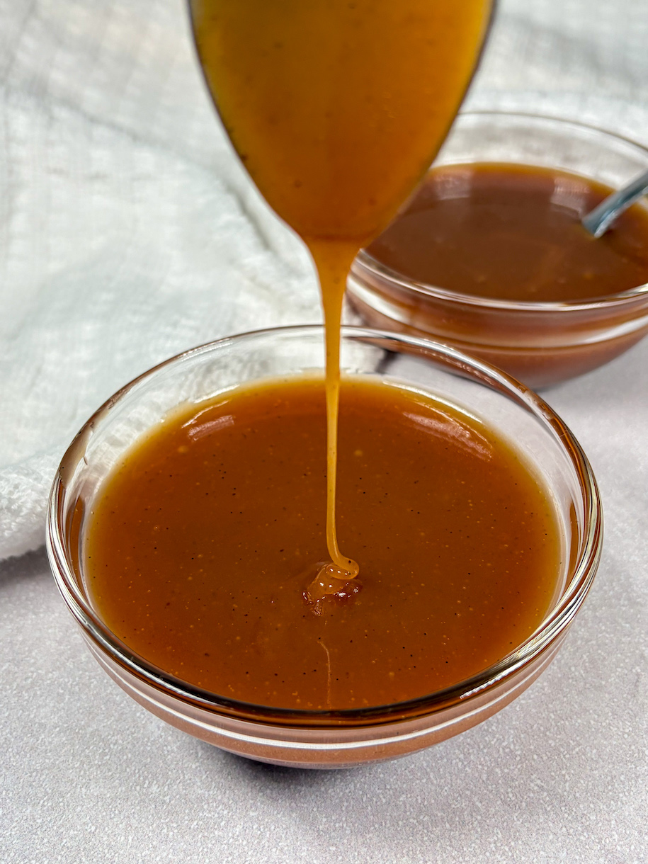 drizzling caramel sauce into a bowl