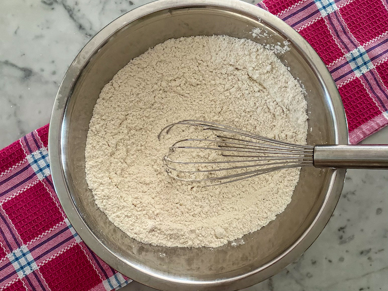 Dry ingredients in a bowl with a whisk