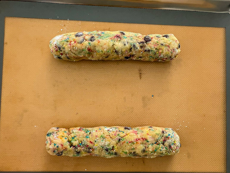 Two biscotti dough logs arranged on a tray