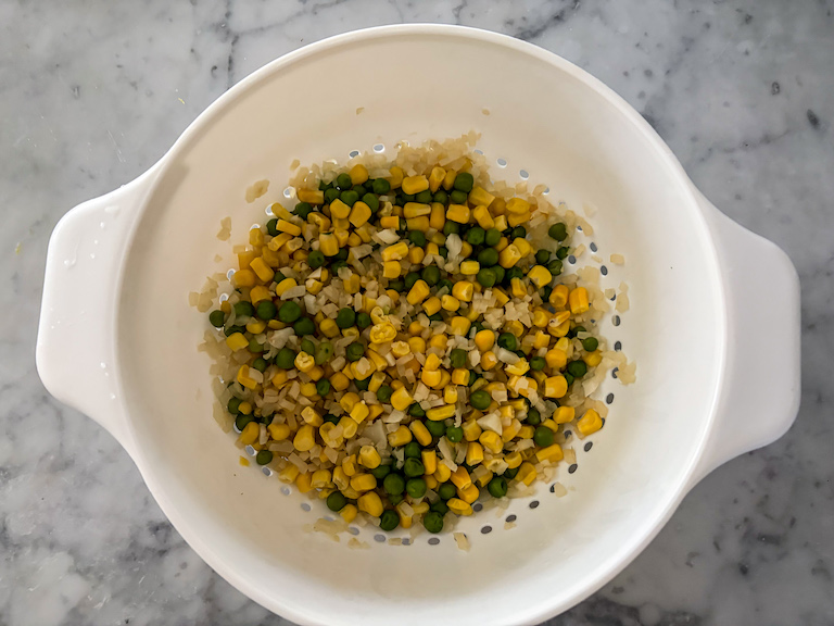 boiled veggies in a colander