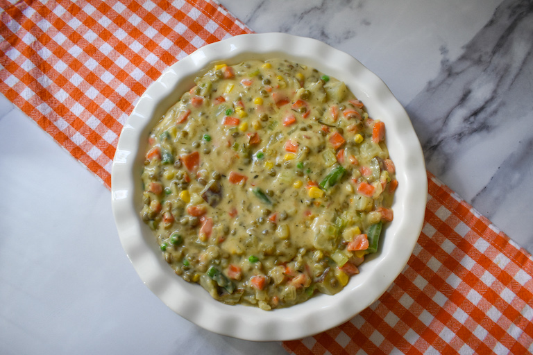 vegetable and lentil filling in a ceramic pie plate