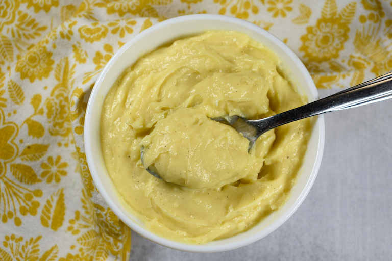 bowl of pastry cream with a spoon
