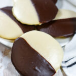 new york black and white cookies on a white plate