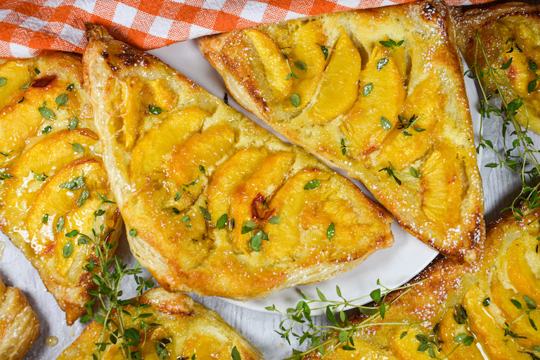 Peach mascarpone puff pastry triangles with honey and thyme