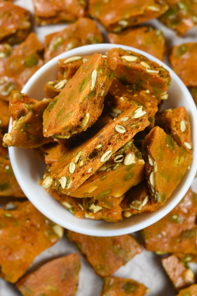 a bowl of spiced pumpkin seed brittle