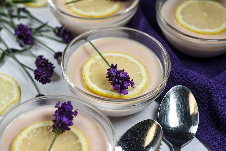 dishes of lavender lemon posset with sprigs of fresh lavender flowers