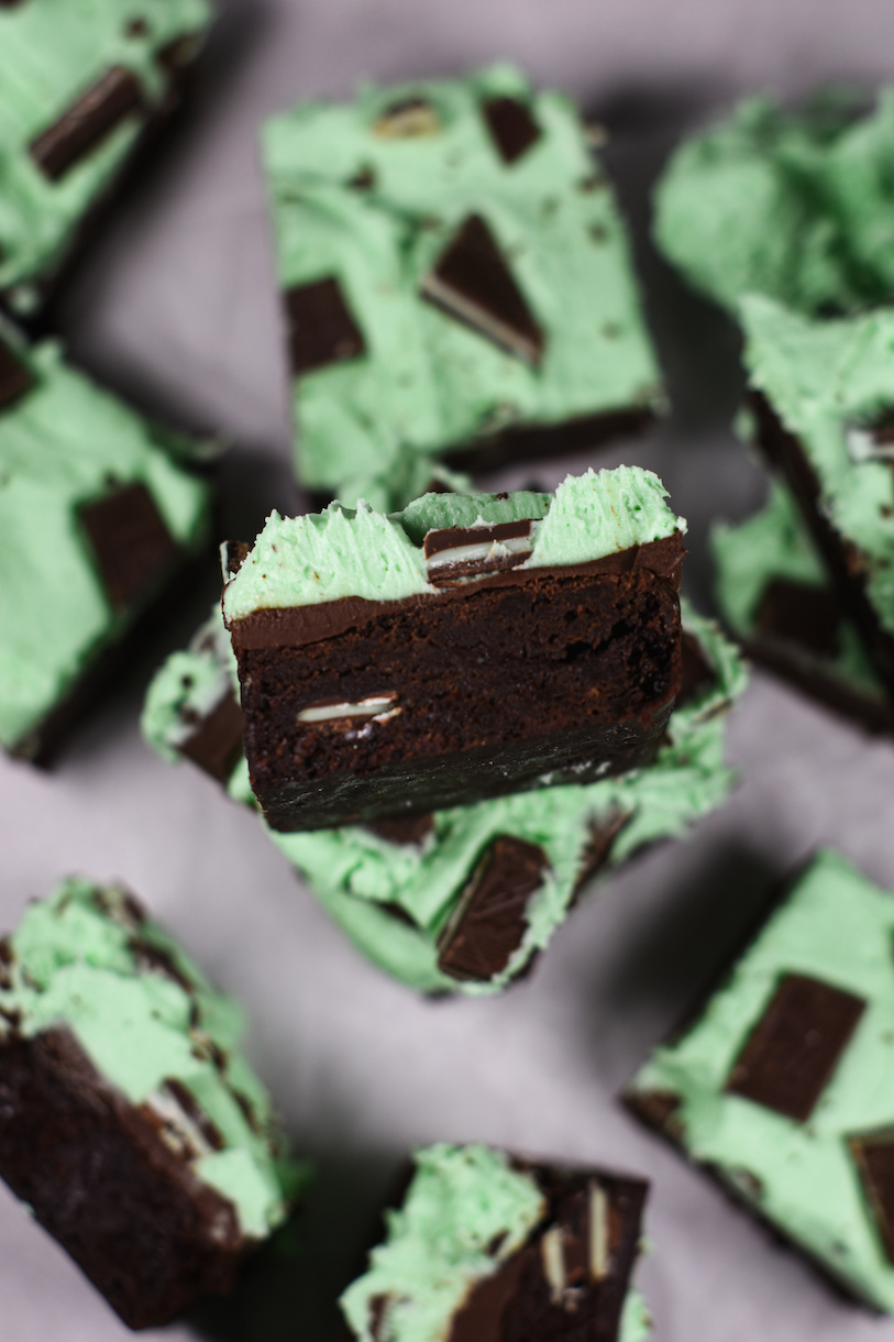 Chocolate mint brownies arranged on a white surface