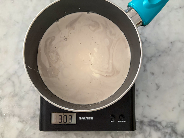 a pan of lavender cream on a kitchen scale