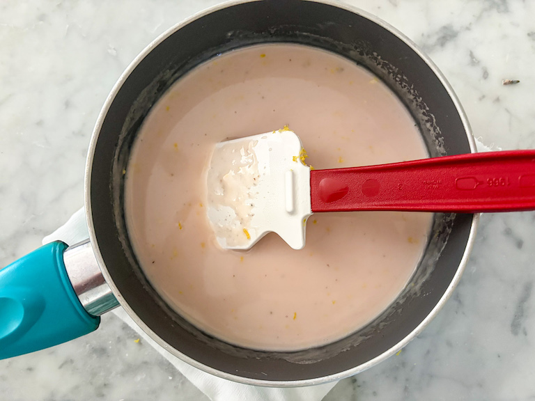 stirring together cream and lemon juice in a small saucepan