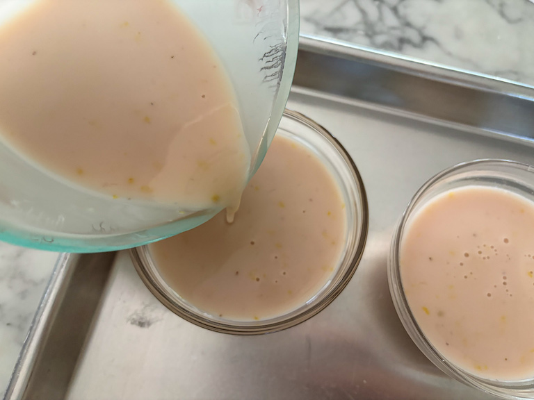 pouring lavender lemon posset into dishes