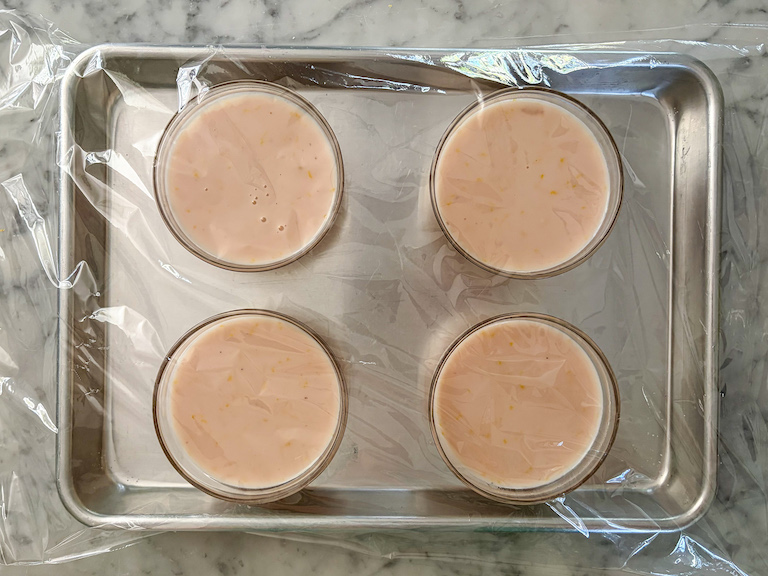 lavender lemon posset mixture poured into small clear glass dishes
