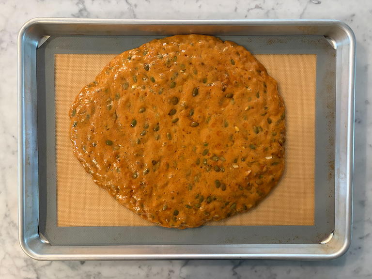 pepita brittle slab poured out on a silicone mat