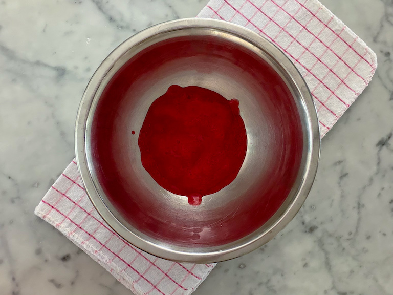 a bowl of raspberry puree