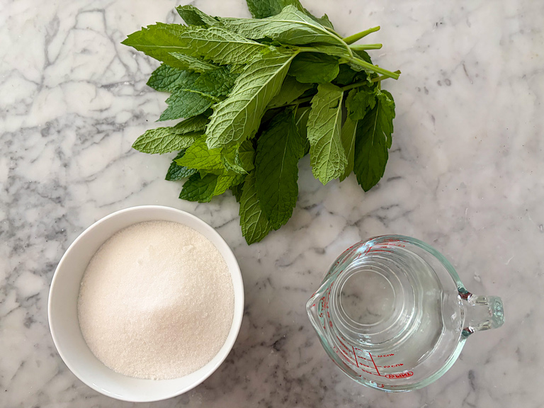 mint syrup ingredients arranged on a marble surface