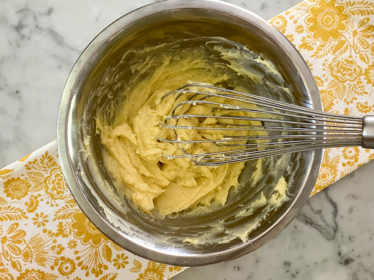 wire whisk knocking back homemade creme pat