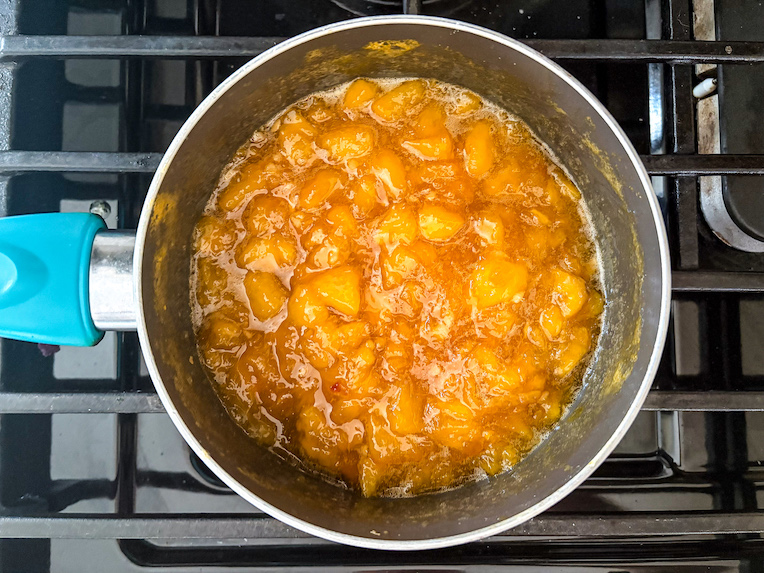 saucepan of peach jam