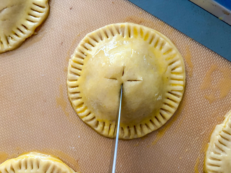 knife cutting a vent in a hand pie