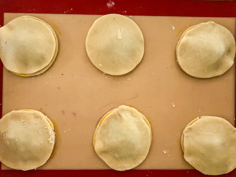 discs of pastry on a tray