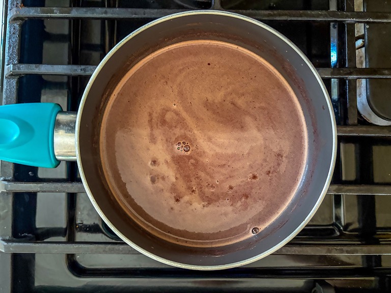 Red wine hot chocolate in a pan on the stovetop
