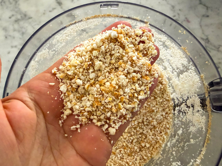 a handful of pieces of crushed popcorn