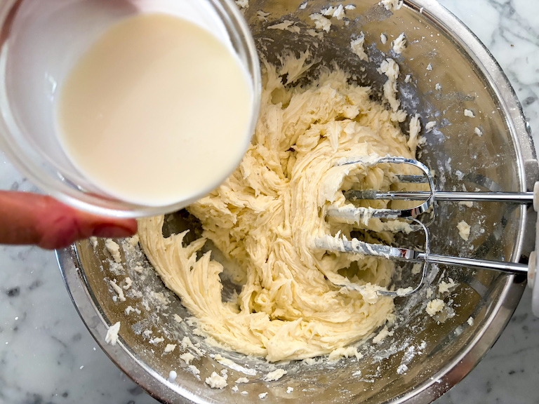 adding cream to caramel frosting