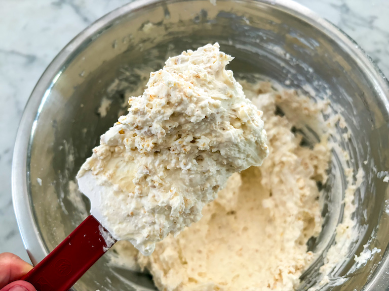 a spatula of caramel corn frosting