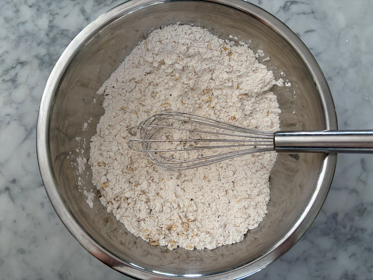 dry ingredients in a metal bowl with a whisk