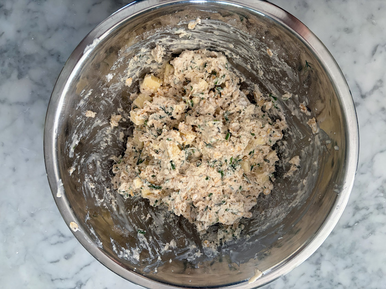 cheddar herb soda bread dough in a bowl