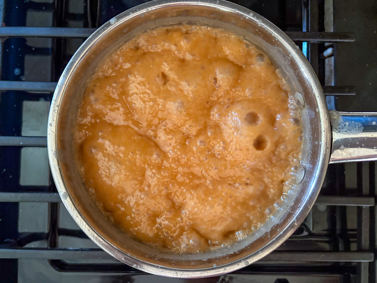 caramel bubbling in a saucepan