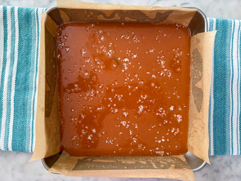 a pan of rosemary caramels sprinkled with sea salt