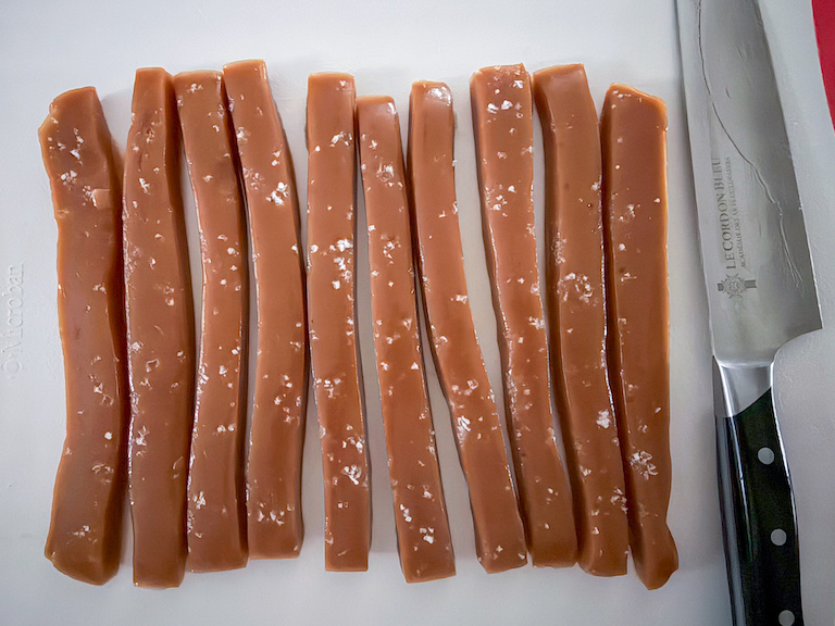 slicing rosemary caramels with a sharp knife