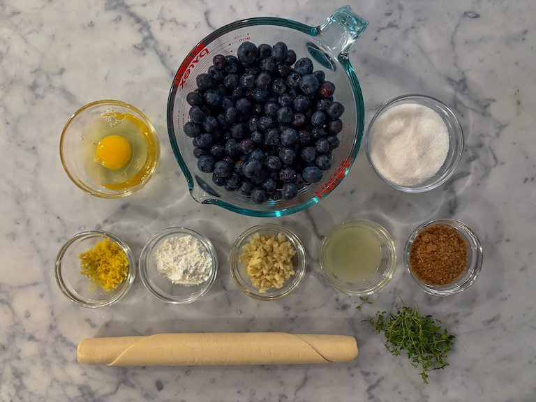 blueberry galette recipe ingredients on a marble surface