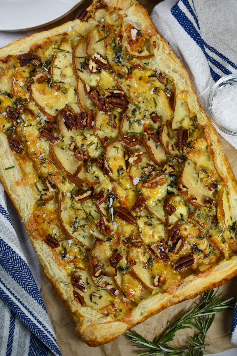 a puff pastry tart with sliced pears, blue cheese, pecans, and sea salt