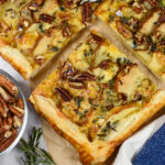 a slice of puff pastry tart with cheese and pears