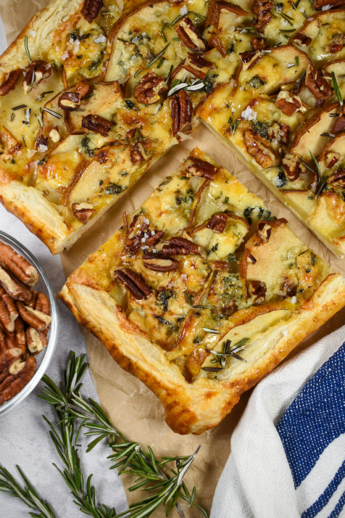 a slice of puff pastry tart with cheese and pears