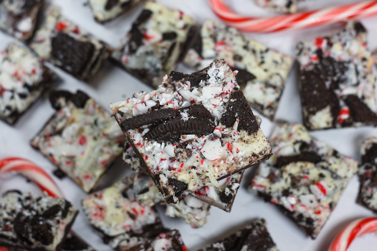 a stack of peppermint bark on a white surface