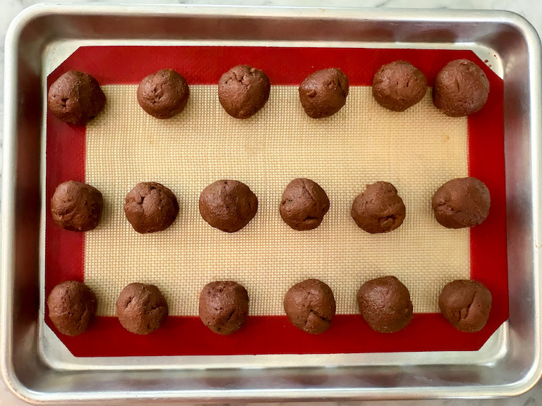 balls of milk chocolate pumpkin ganache on a small tray