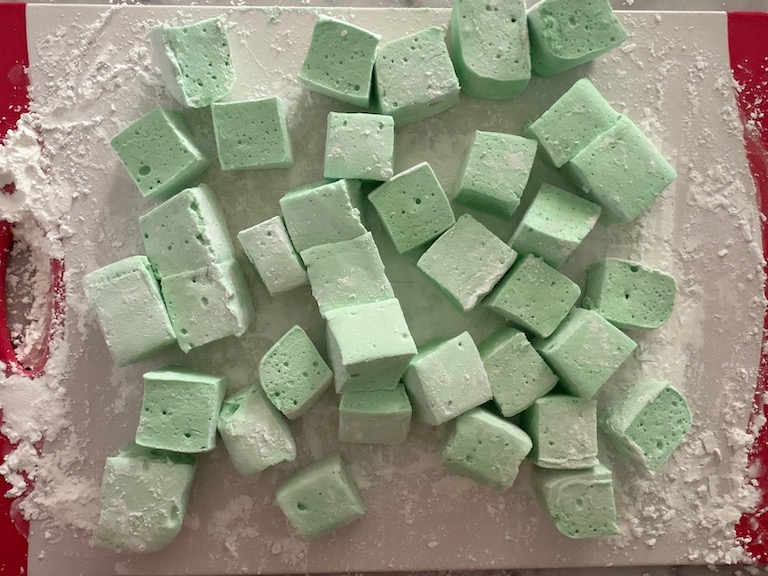 peppermint marshmallows on a cutting board