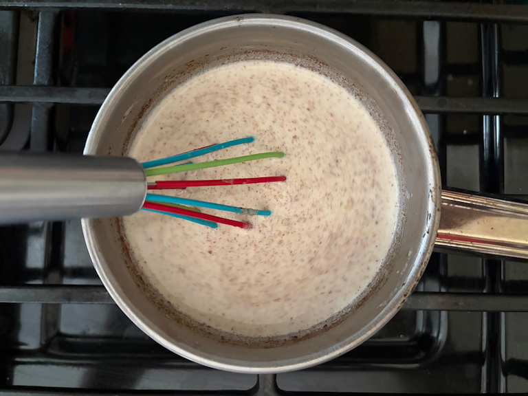 warming the spiced cream in a small saucepan