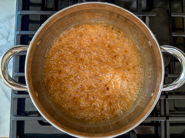 Cooking caramel in a pot on the stovetop